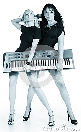 Blonde and brunette with electric piano Stock Photo