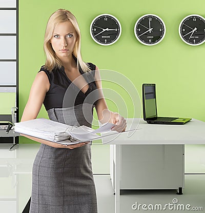 Blonde business woman with classifier Stock Photo