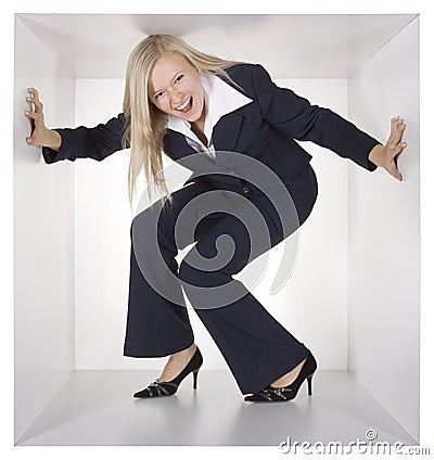 Blonde businesswoman in the white cube Stock Photo