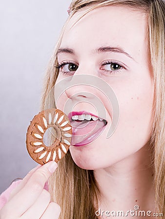 Blonde girl eating cookie Stock Photo