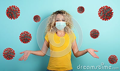 Blonde girl has doubt about covid19 corona virus. Cyan background Stock Photo