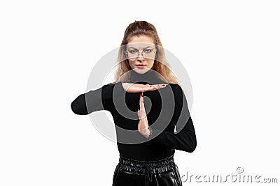 Blonde girl looking serious, stern, angry and displeased, making time out sign, gesture concept Stock Photo