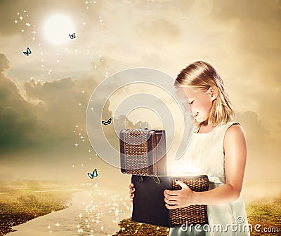 Blonde Girl Opening a Treasure Box Stock Photo