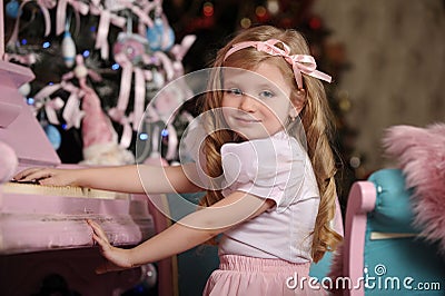 Blonde girl with pink pianos Stock Photo