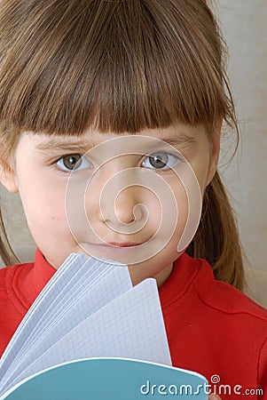 Blonde girl portrait reading a book. Stock Photo