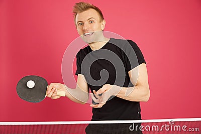 Blonde Haired Male playing table tennis Stock Photo