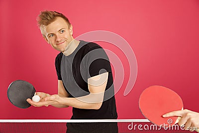 Blonde Haired Male playing table tennis Stock Photo