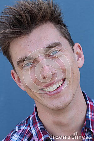 Blonde handsome man with blue eyes on blue background Stock Photo