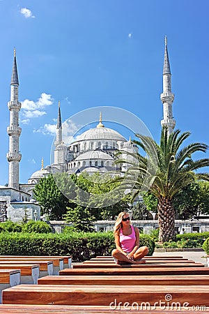 Blonde in Istanbul at the Blue Mosque Stock Photo