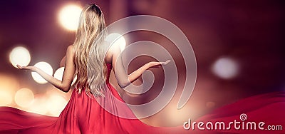 Blonde lady in red elegant maxi dress. Stock Photo