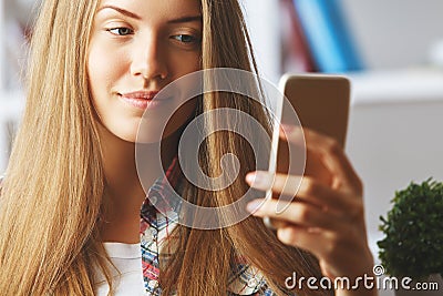 Blonde lady using cellphone Stock Photo