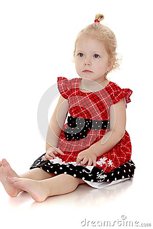 Blonde little girl he floor Stock Photo