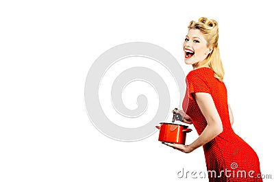 Blonde pin up woman housewife holding pan. Studio shot over white background isolated. Young woman cooking. Portrait of Stock Photo