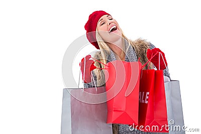 Blonde in winter clothes with shopping bags Stock Photo