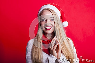 Blonde wishful woman in christmas jelly bag hat Stock Photo