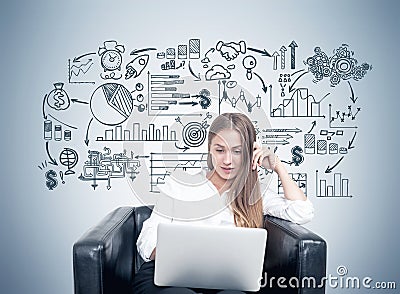 Blonde woman in armchair, business plan, gray Stock Photo