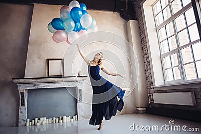 Blonde woman dance with balloons Stock Photo