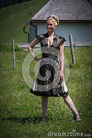 Blonde woman in designer dirndl Stock Photo