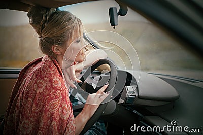 blonde woman at french style driving a retro car 80th at rainy day, relax autumn mood Stock Photo