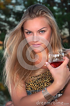 blonde woman with a glass Stock Photo