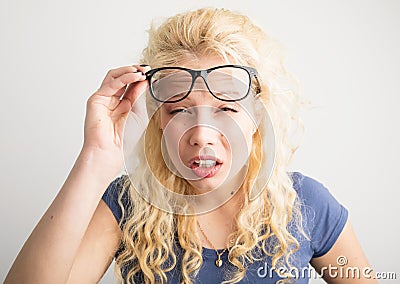 Woman with her glasses lifted up can`t see Stock Photo