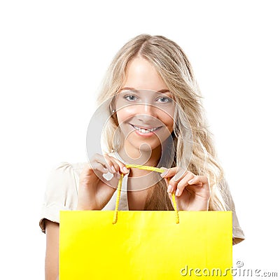 Blonde woman holding yellow shopping bag Stock Photo