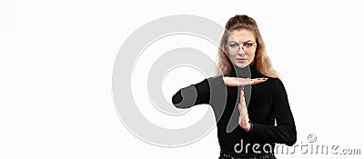 Blonde woman looking serious, stern, angry and displeased, making time out sign. Place for ad Stock Photo