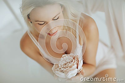 Portrait Blonde woman posing in white lingerie Stock Photo
