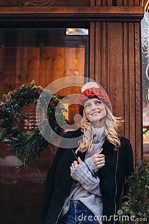 Blonde woman in red knitted hat Stock Photo