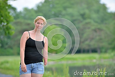 Blonde woman on a summer stroll Stock Photo