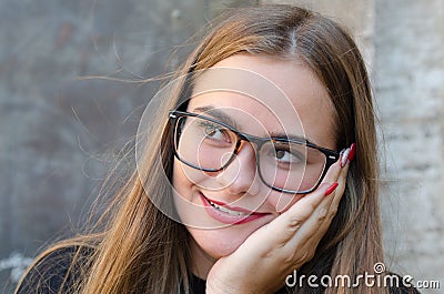 Woman wearing glasses and laughing, with red lips and nails Stock Photo