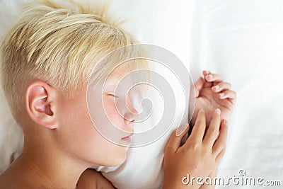 Blondy boy sleeping. Stock Photo