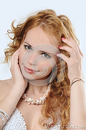 Blondy woman touches her face and hair Stock Photo