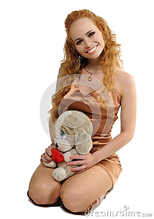 Blondy woman with a toy Stock Photo