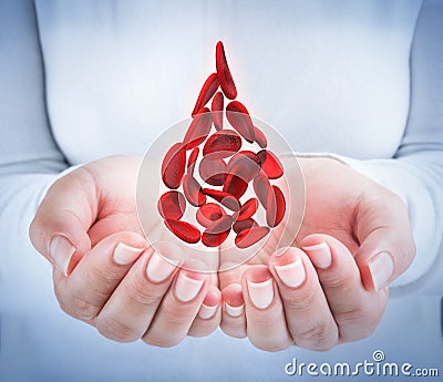 Blood cells in hands - shaped blood drop Stock Photo