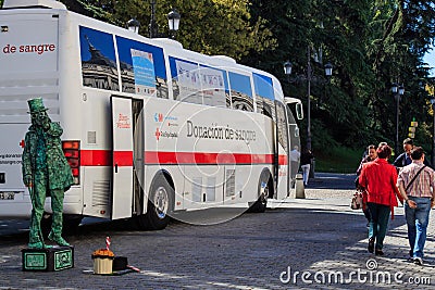 Blood donation bus in front of Royal Palace, Madrid, Spain Editorial Stock Photo