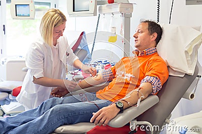 Blood donor at donation. Stock Photo