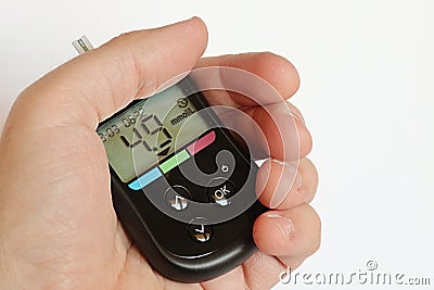 Blood glucose meter with healthy person preprandial blood glucose value Stock Photo