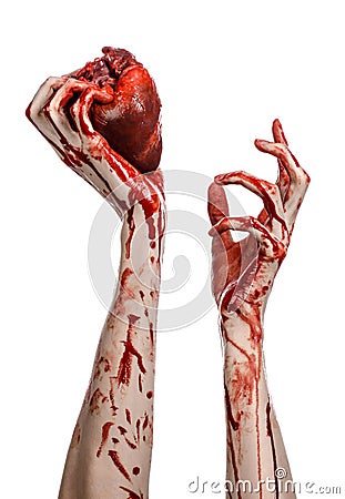 Blood and Halloween theme: terrible bloody hand hold torn bleeding human heart isolated on white background in studio Stock Photo