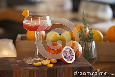 Blood orange alcohol beverage with ingredients in background Stock Photo