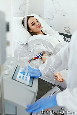 Blood Ozone Therapy. Woman At Blood Transfusion Treatment Stock Photo
