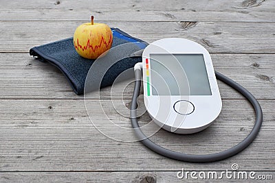 Blood pressure measuring device and apple Stock Photo