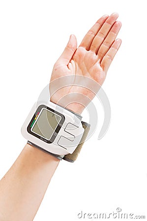 Blood pressure monito on hand Stock Photo