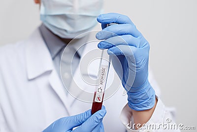 Blood test tube in doctor hand, Mers-CoV Coronavirus test Positive label in hospital blood test tube for analysis. 2019-nCoV virus Stock Photo