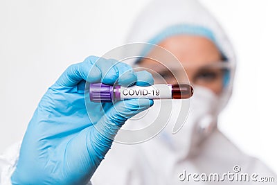 Blood test tube in doctor hand, Mers-CoV Coronavirus test Positive label in hospital blood test tube for analysis Stock Photo