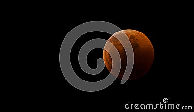 Bloody moon close-up against a black sky as a result of an astronomical event lunar eclipse. View in telescope, placement on the s Stock Photo