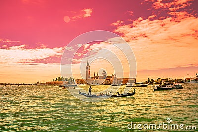 Bloody reddish sunset in amazing Venetian Grand Channel, Venice, Italy Editorial Stock Photo