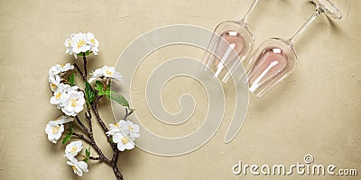 Blooming cherry branch artificial flat lay glasses with rose wine on a concrete background. Beautiful spring background. Top Stock Photo
