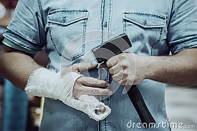 Blow on the finger with a hammer Stock Photo