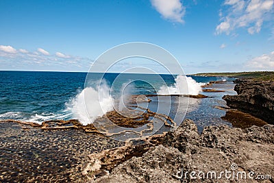 Blow Holes in Tonga, water spouting out rocks on shore of South Pacific Ocean Stock Photo